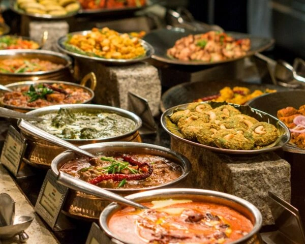 Buffet of authentic Indian curries and traditional dishes served at a family Indian restaurant.